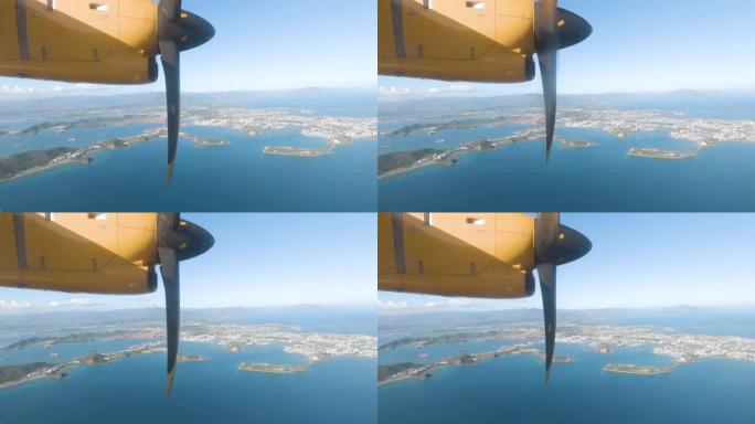 努美阿市和海滨水区的飞机窗户的航拍画面。新喀里多尼亚。