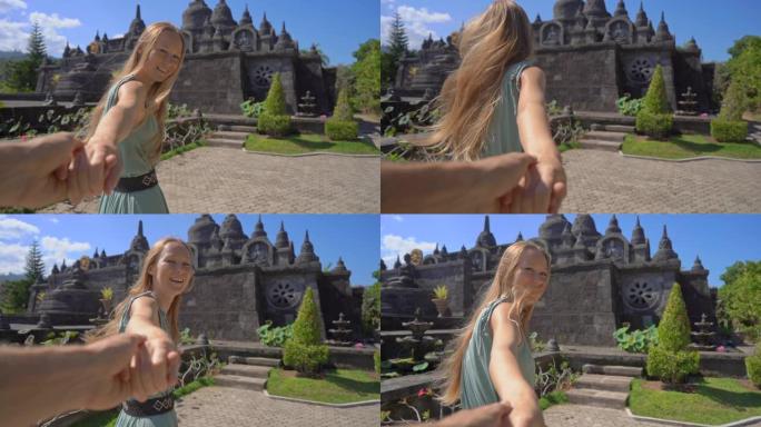 慢动作镜头。游客妇女和男子参观印度尼西亚巴厘岛的梵天Vihara Arama寺。巴厘岛旅游概念