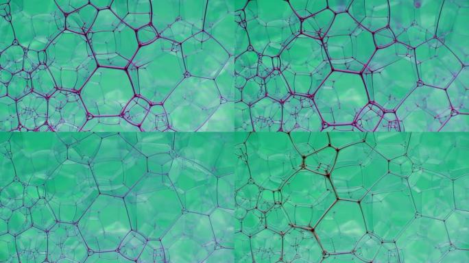 彩色肥皂泡沫与爆裂气泡背景。摘要生物结构，大分子模式。紫色墨水填充了大量在液体中形成的蓝色气泡。自然
