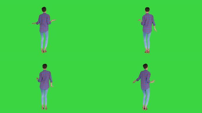 穿着休闲衬衫的女人在绿色屏幕上跳舞，色键