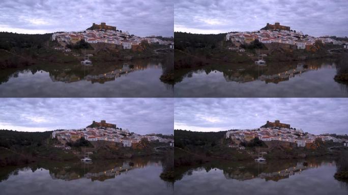 葡萄牙阿连特茹瓜迪亚纳河日落时的默托拉城市景观
