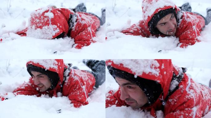 疲惫的流浪汉在雪地里爬行。