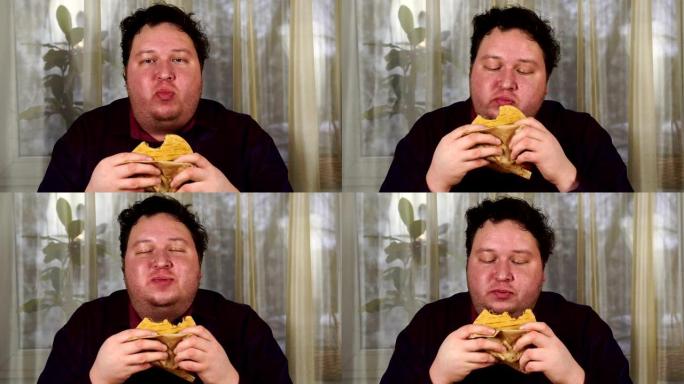 年轻人咬三明治。胖子吃快餐。非常饿的家伙。