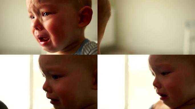 一个18个月大的婴儿独自痛苦地哭泣的肖像。近距离肖像，儿童心理发展