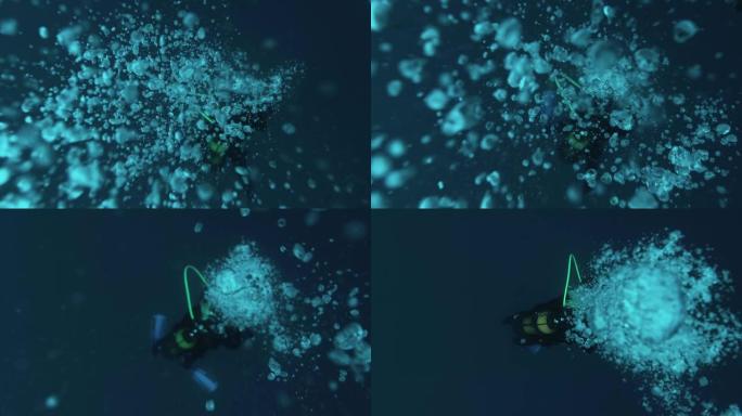 海洋中有气泡的水下潜水员。气泡漂浮在热带蓝色的海面上。