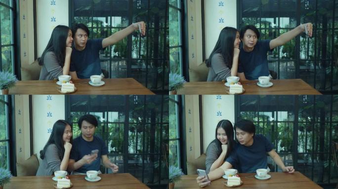 东南亚年轻夫妇在咖啡厅自拍
