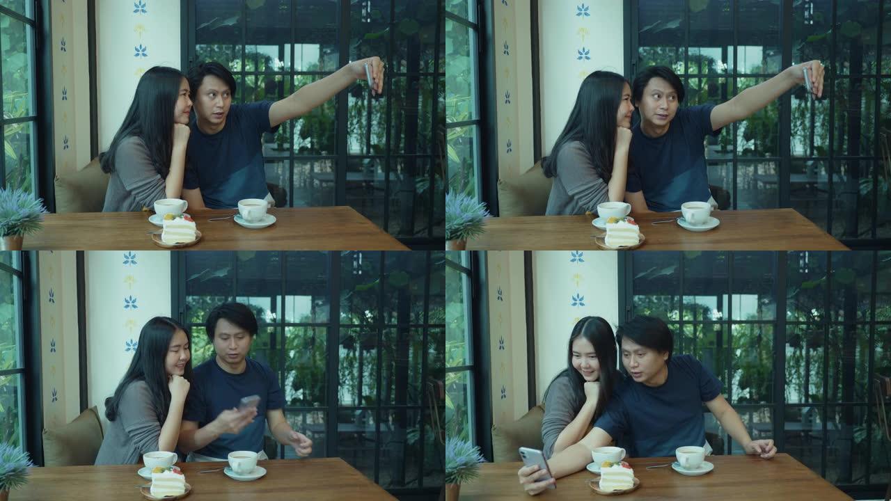 东南亚年轻夫妇在咖啡厅自拍