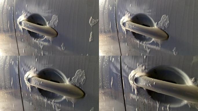 男子在自助洗车处洗车。自助洗车服务。汽车视图。镜头1080p 60fps。视频