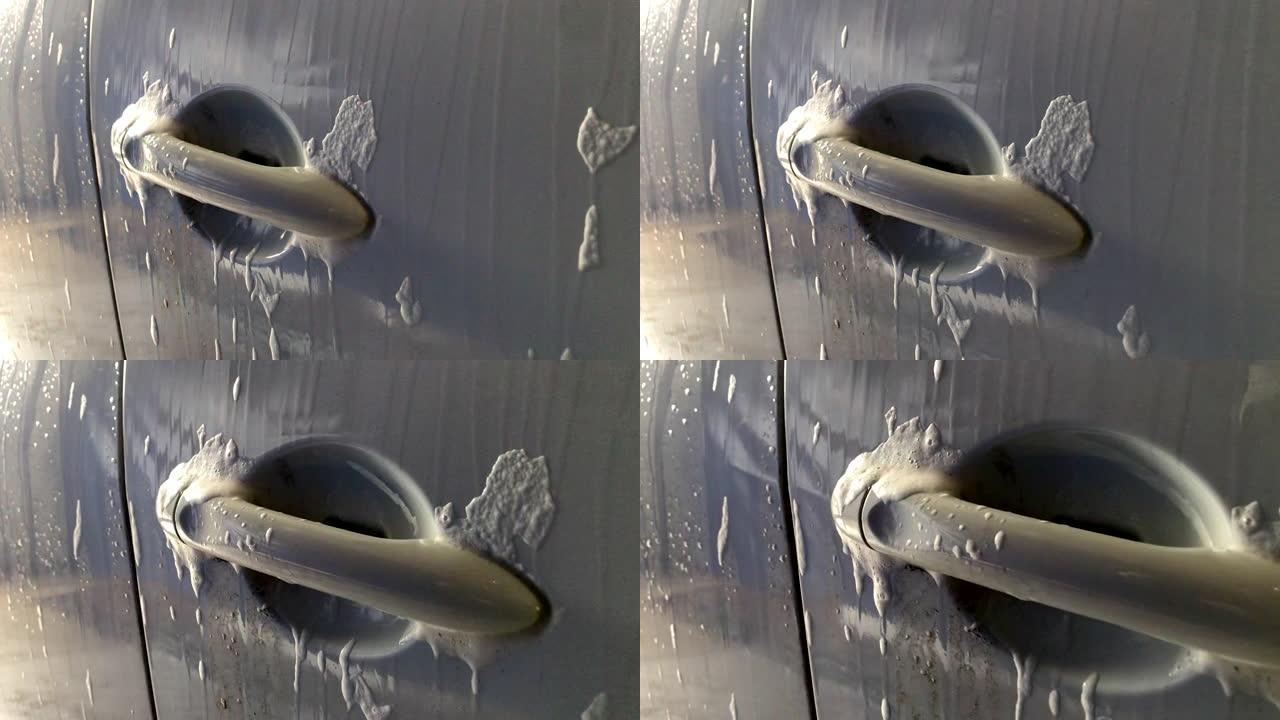男子在自助洗车处洗车。自助洗车服务。汽车视图。镜头1080p 60fps。视频