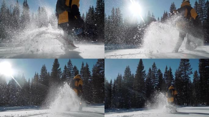 慢动作特写拍摄成人徒步旅行者在户外深雪中穿着雪鞋快速奔跑