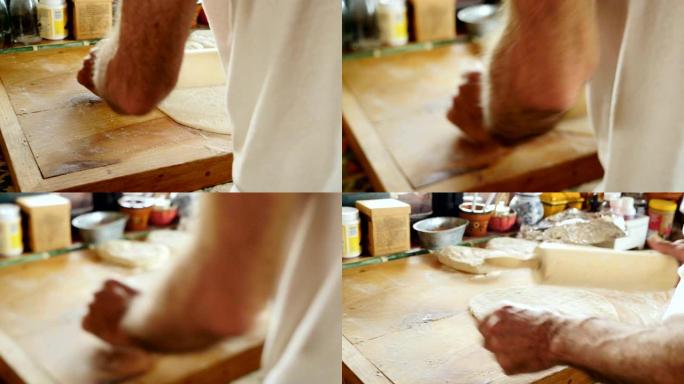 一名男子在其家庭厨房的木制砧板上使用A面杖