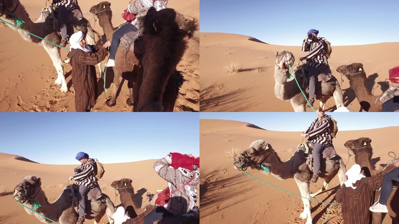 非洲撒哈拉沙漠乘坐骆驼火车的游客