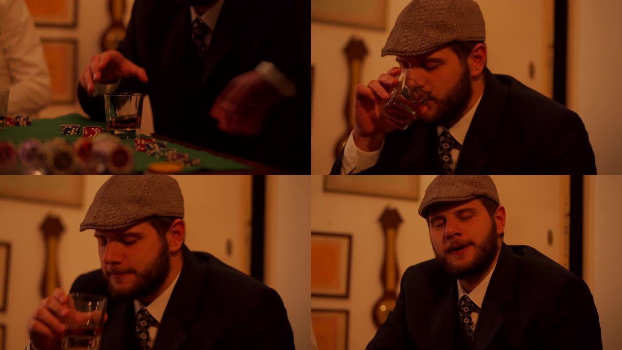 一名男子在扑克桌上喝威士忌的特写镜头