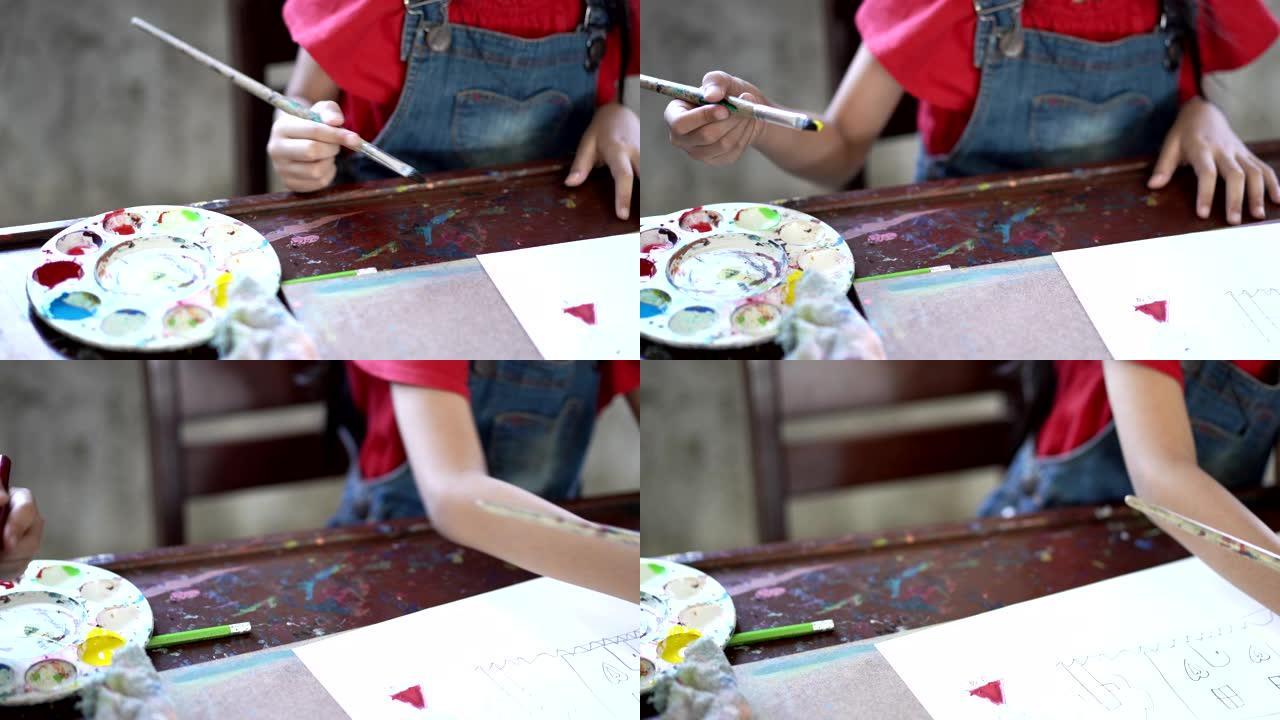 一群亚洲儿童学生在艺术教室里，在学校画画和信心。