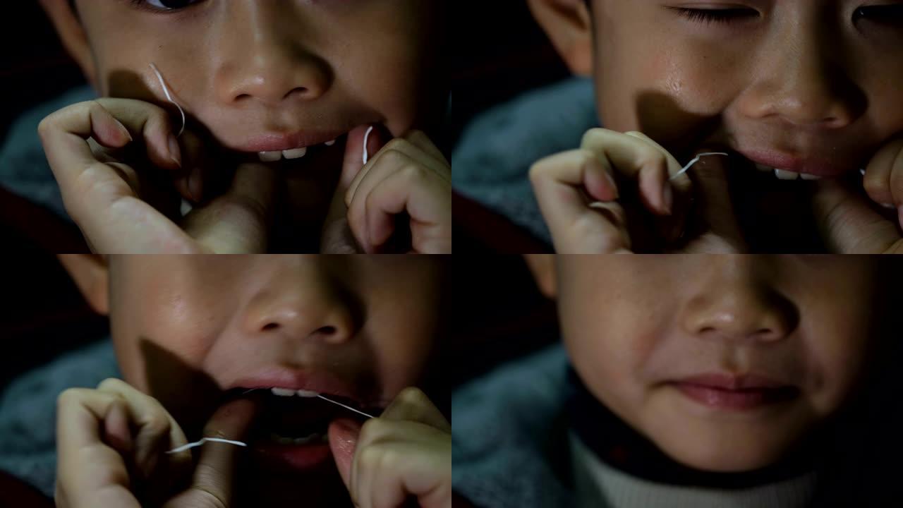 亚洲男孩使用牙线亚洲男孩洁牙使用牙线