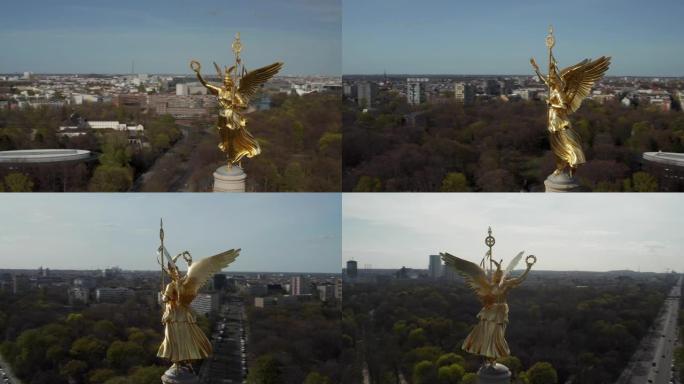 空中: 在美丽的阳光下围绕柏林胜利柱金色雕像维多利亚的特写