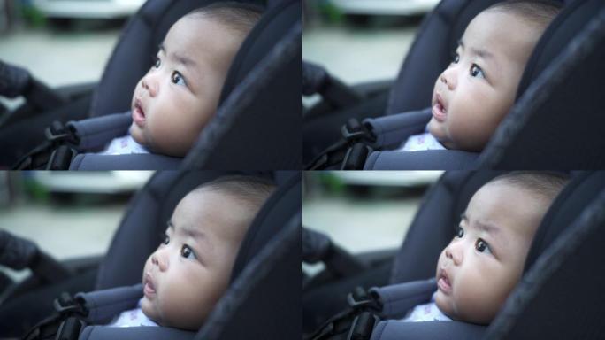一张可爱的亚洲新生男婴抬头的脸部照片