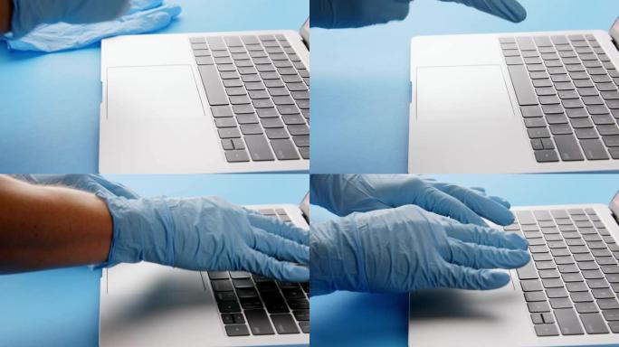使用笔记本电脑前戴上防护乳胶手套的人