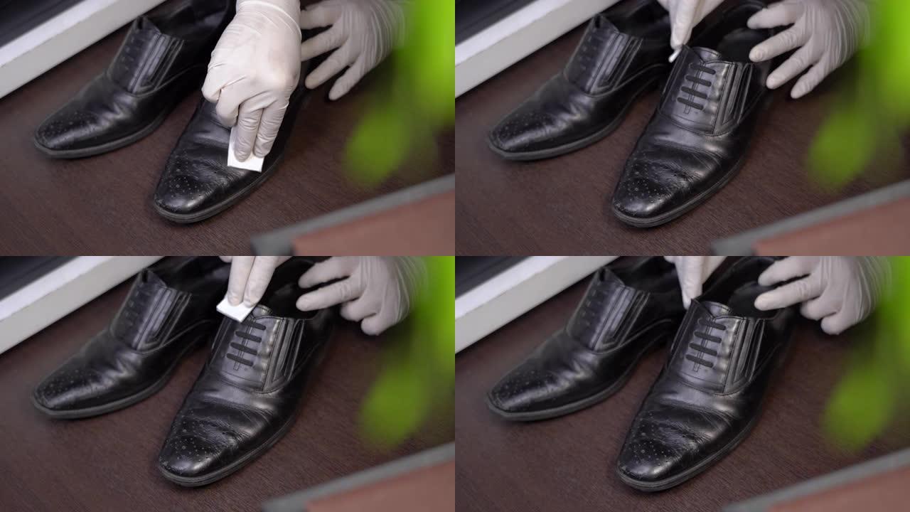 4k手戴白色防护手套擦拭黑色真皮男鞋，带回家细菌、消毒液擦拭、护理、冠状病毒COVID-19传播、杀
