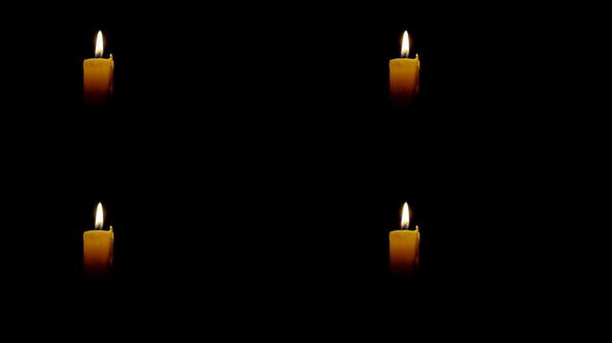 蜡烛在黑暗中燃烧，特写