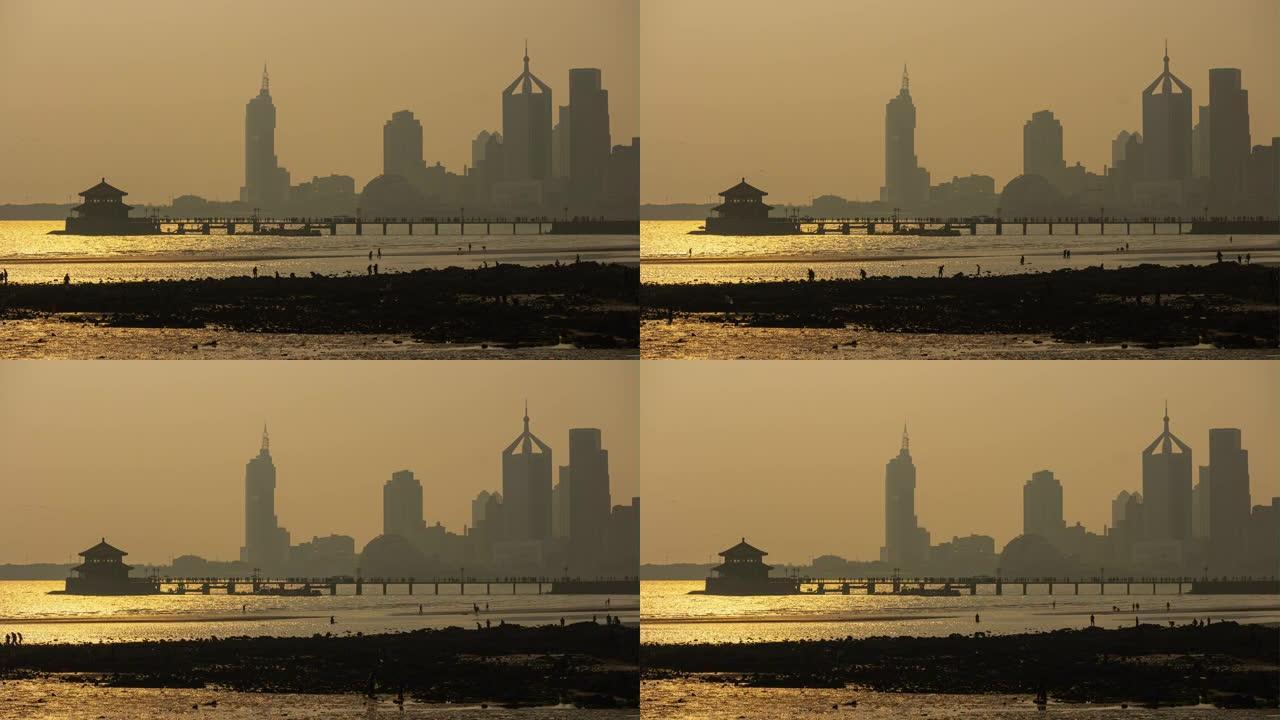 日落时间青岛城市景观著名海滩地段潮汐码头延时全景4k中国