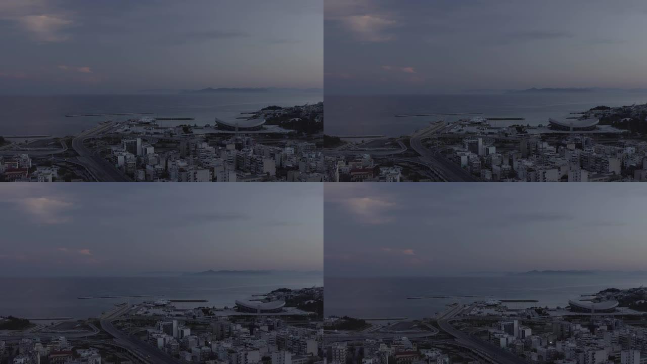 空中原始镜头-雅典-黄昏时在比雷埃夫斯-皮雷亚斯的城市和港口上空飞行