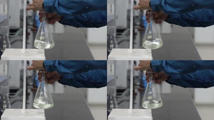 滴定反应是在滴定管下在锥形烧瓶中摇动无色液体。