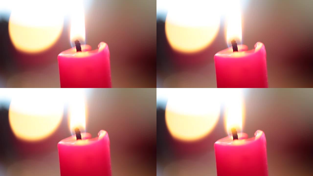 明亮的火焰燃烧节日蜡烛背景bokeh