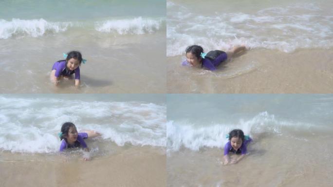 快乐的亚洲儿童在海里游泳，女孩在夏季热带旅行，享受休闲，在假期的海滩上进行儿童活动，在假期，生活方式