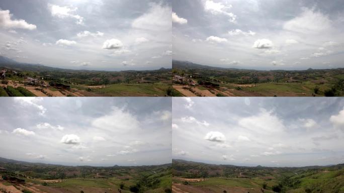 视频从左移到山的右侧，在泰国Phetchabun的Khao Kho的天空中，城镇背景是美丽的云彩。