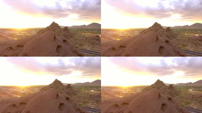 亚利桑那州凤凰城外的山脉和道路上的太阳落山鸟瞰图