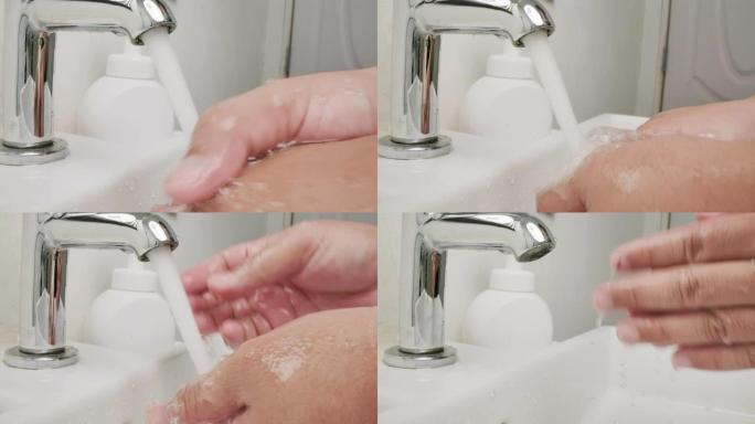 一男子手用水洗手卫生预防电晕病毒疫情新型冠状病毒肺炎