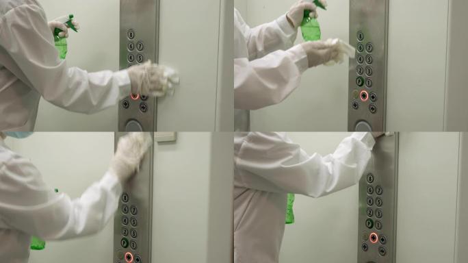 妇女使用湿巾和酒精消毒剂喷雾清洁电梯按钮控制面板。消毒，清洁和保健，抗冠状病毒新型冠状病毒肺炎