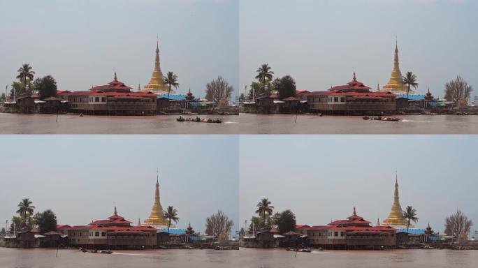 缅甸因勒湖海岸线附近的传统建筑，独木舟经过