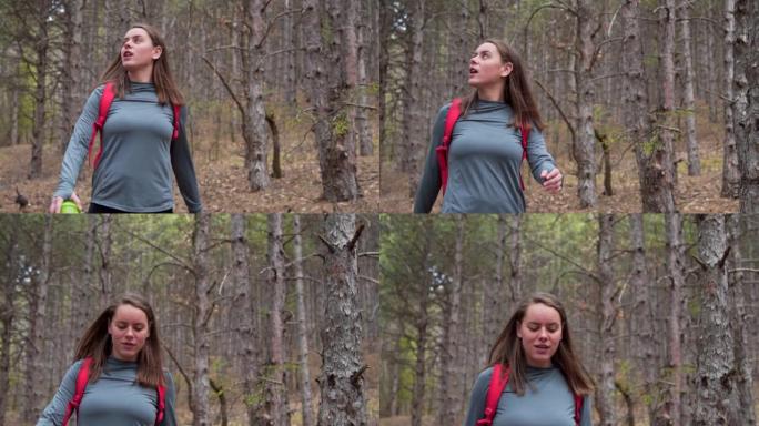 运动女子徒步旅行和拍摄森林照片