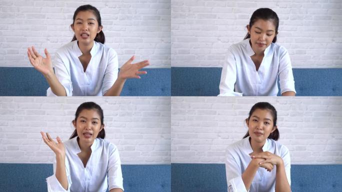 快乐友好的亚洲女性看着相机说话，做视频电话会议，在家在线面试。千禧一代女性互联网教师导师和vlogg
