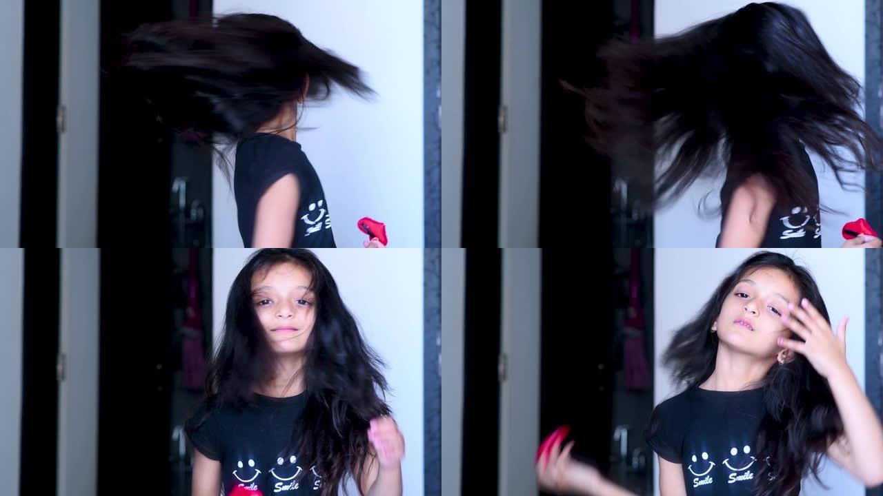 2020年3月23日，印度莫尔比: 可爱的开朗女孩玩头发。