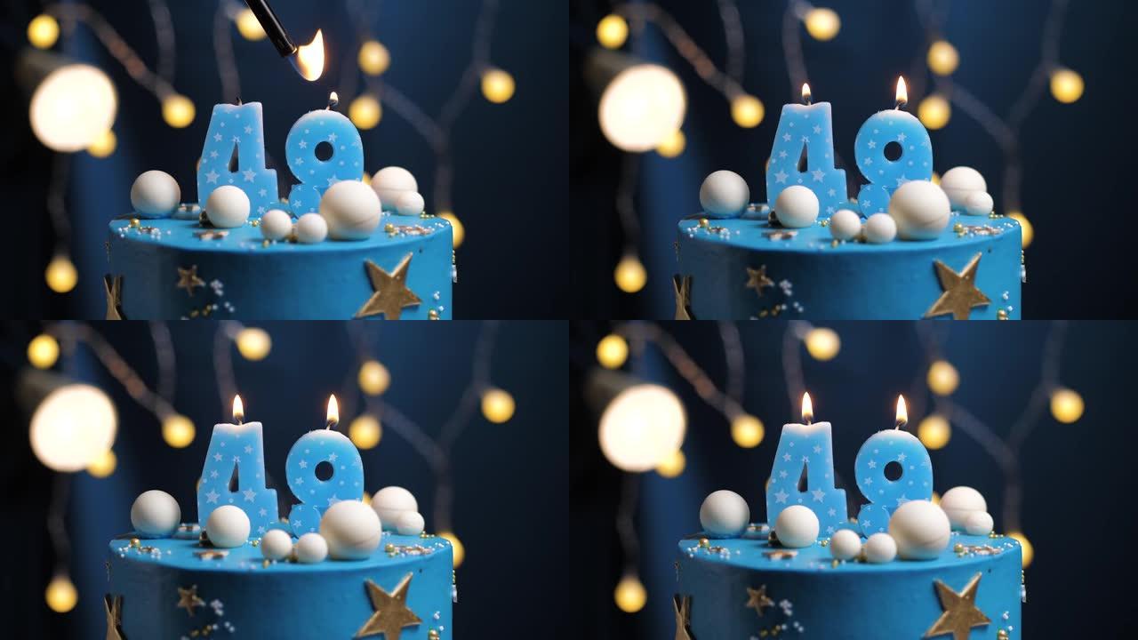 生日蛋糕编号49星星天空和月亮概念，蓝色蜡烛被打火机点燃，然后吹灭。如果需要，请在屏幕右侧复制空间。