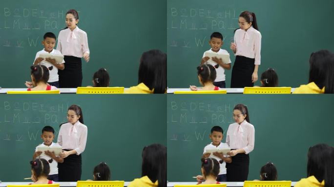 英语课上，亚洲男孩看书。