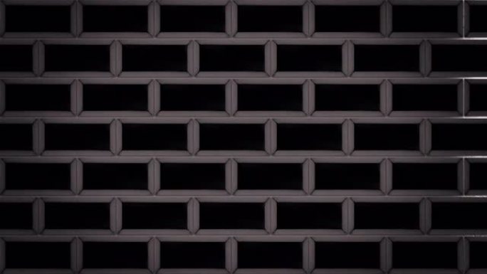 抽象的黑砖出现并在灰色背景上形成墙壁。动画。飞行相同大小的矩形站在水平平行的行中，单色