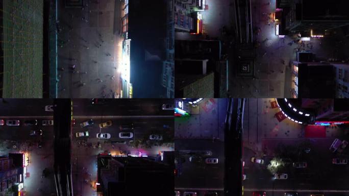 青岛市夜间照明著名步行街，带食品和商店空中俯拍全景4k中国
