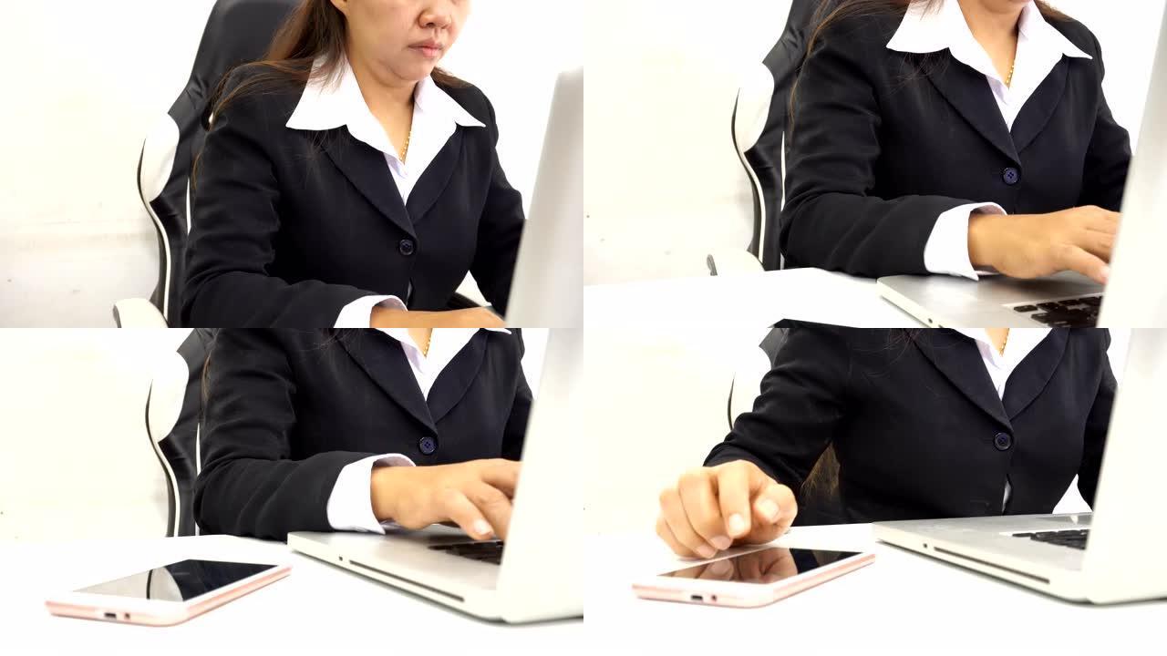 商业女性使用笔记本电脑工作