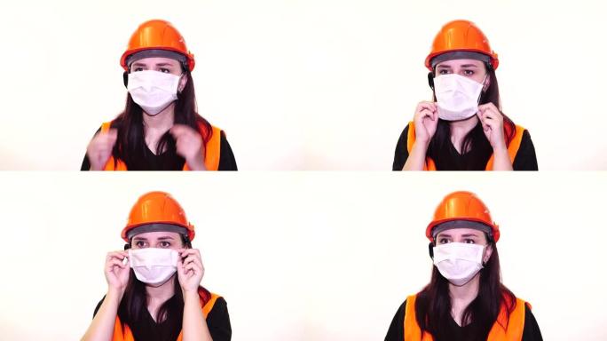 白色背景上戴着医用面具的年轻女子的肖像。成年女性用口罩遮住脸，以保护自己免受疾病的侵害。冠状病毒流行