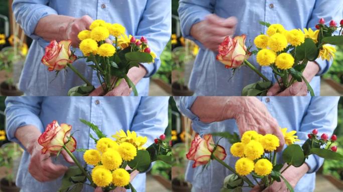 大龄妇女手握一束鲜花的特写镜头