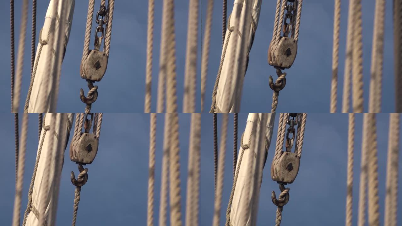 一艘古老的传统船的甲板上的吊钩和手绳葫芦。