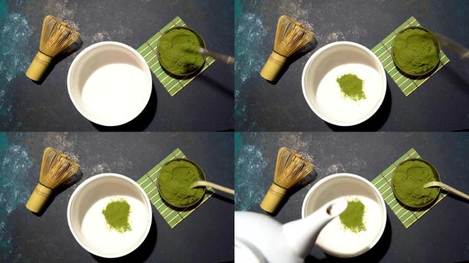 将抹茶粉放在白碗中，竹子放在蓝色的混凝土板上。