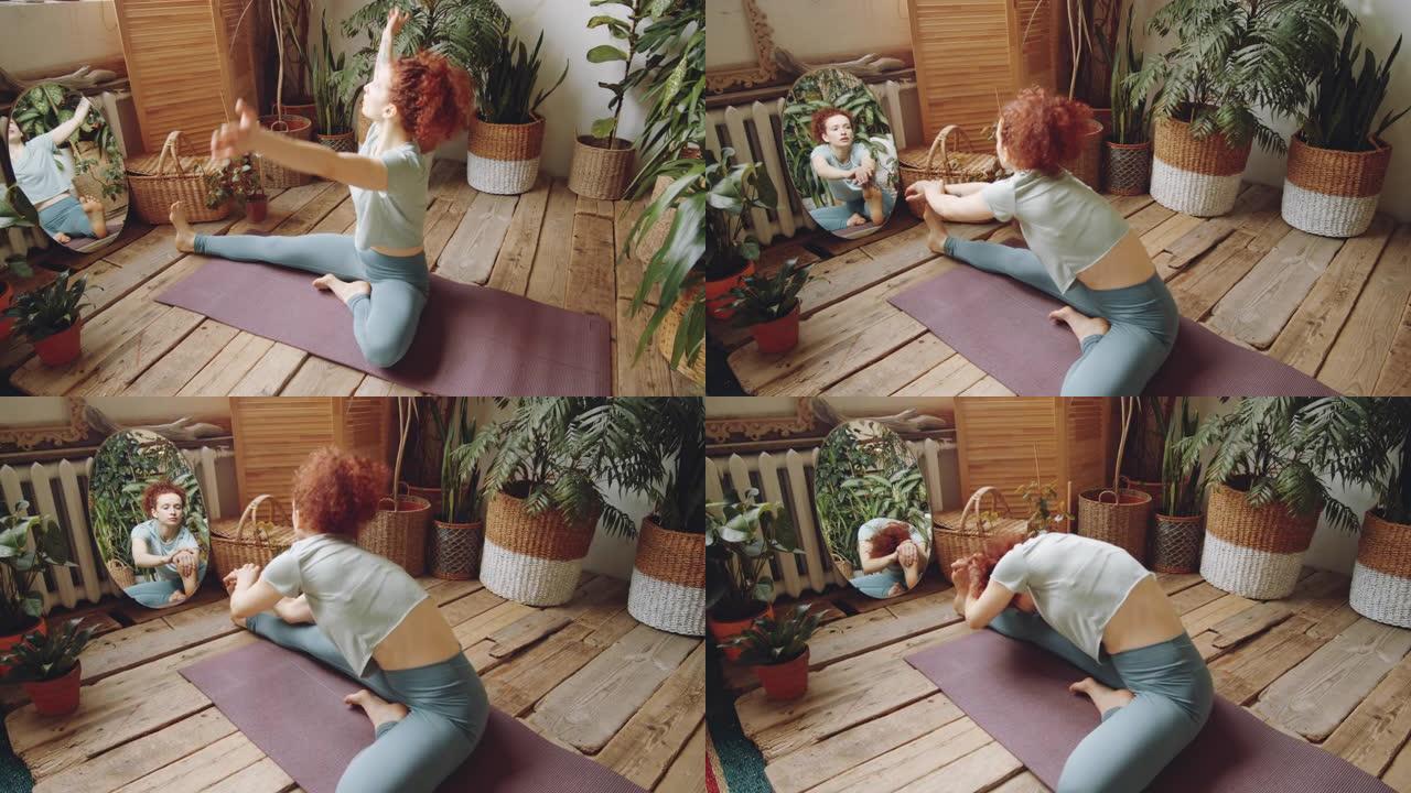 女人在家里练习瑜伽时从头到膝盖向前弯曲