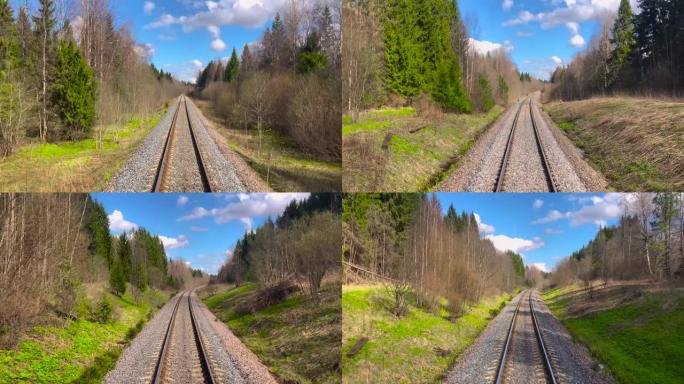 火车行驶时的铁路景色，在春天晴朗的天气下在林木中行驶