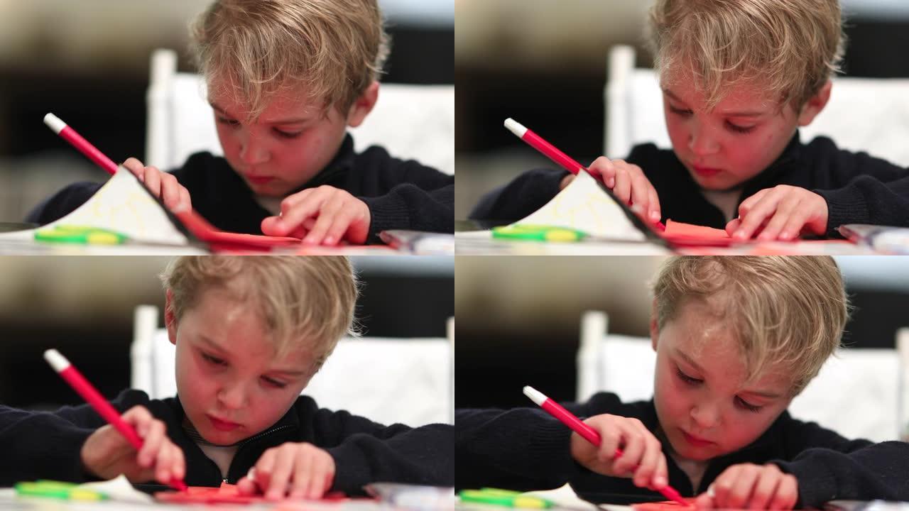 儿童用红笔在纸上画画