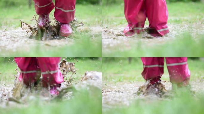 这个女孩在泥坑里玩耍，溅水